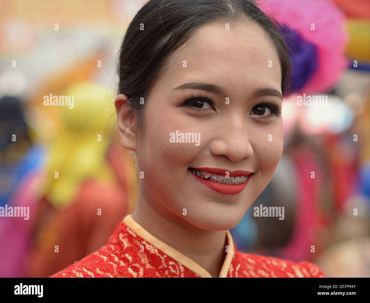 Costumed young female participant and dancer with dental braces at