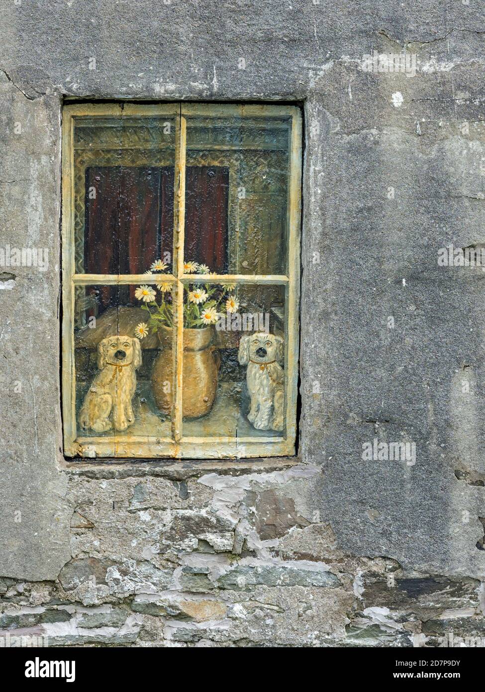 Outside view of window in cottage with picture of china dogs and vase of flowers behind, Bressay, Shetland Stock Photo