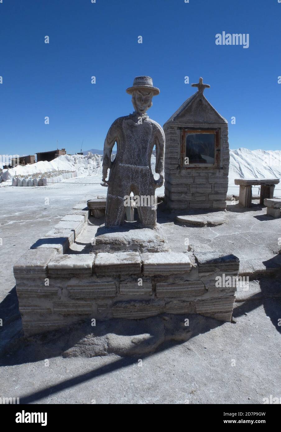 man and shrine both built of salt blocks  Olaroz saltflats, Jujuy, Argentina         January 2009 Stock Photo