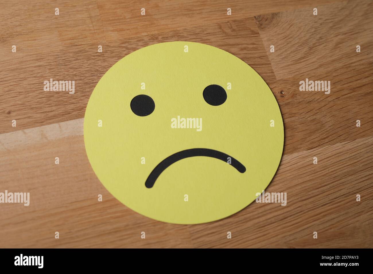 Yellow paper emoji with a sad face expression Stock Photo - Alamy