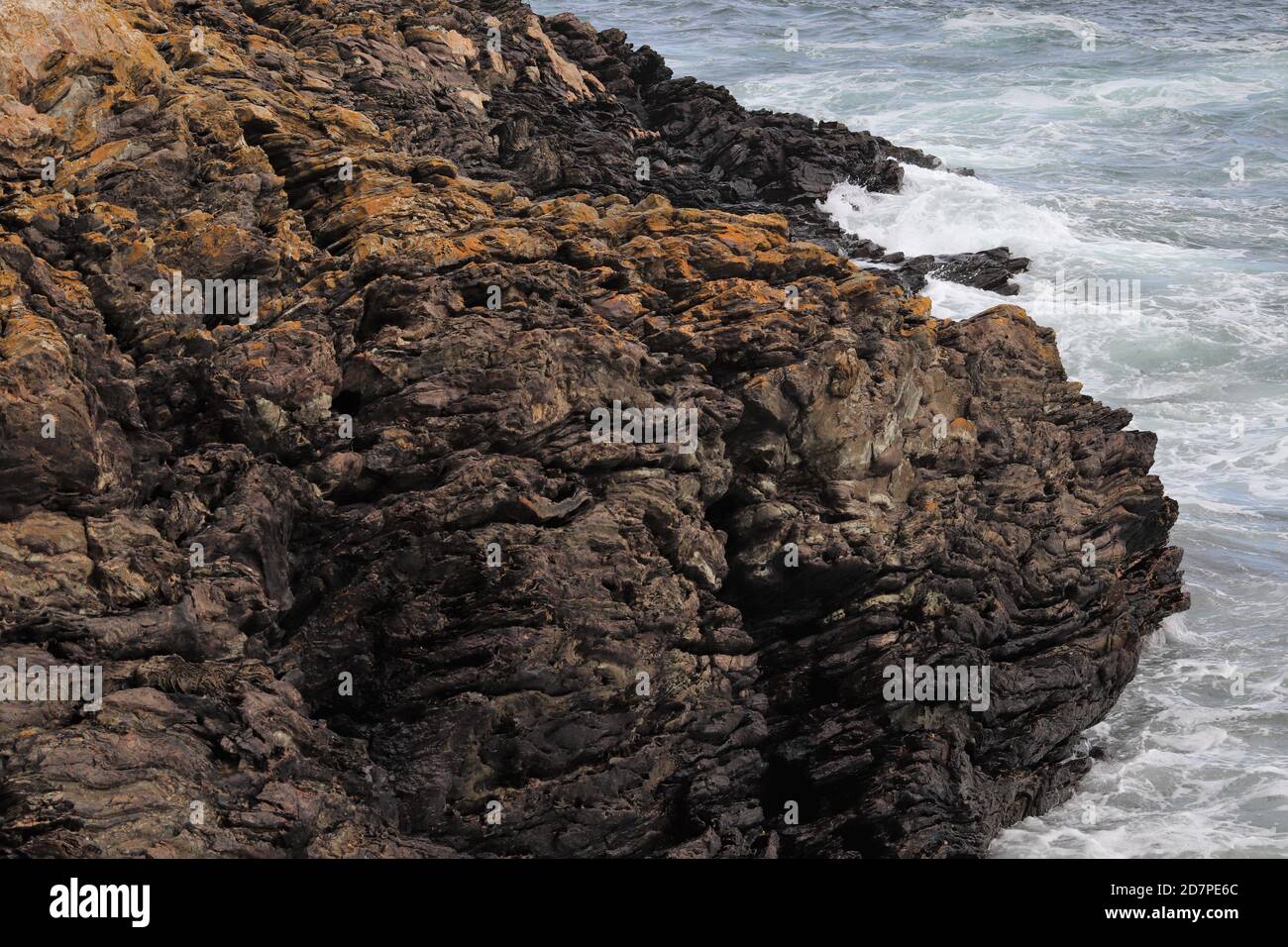 Waves breaking on rocks Stock Photo - Alamy