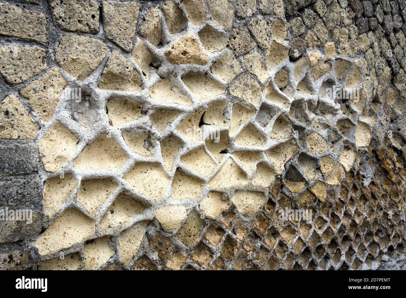 Ancient wall with washed out limestone and remaining concrete. Herculaneum Archaeological site, Ercolano, Italy. Stock Photo