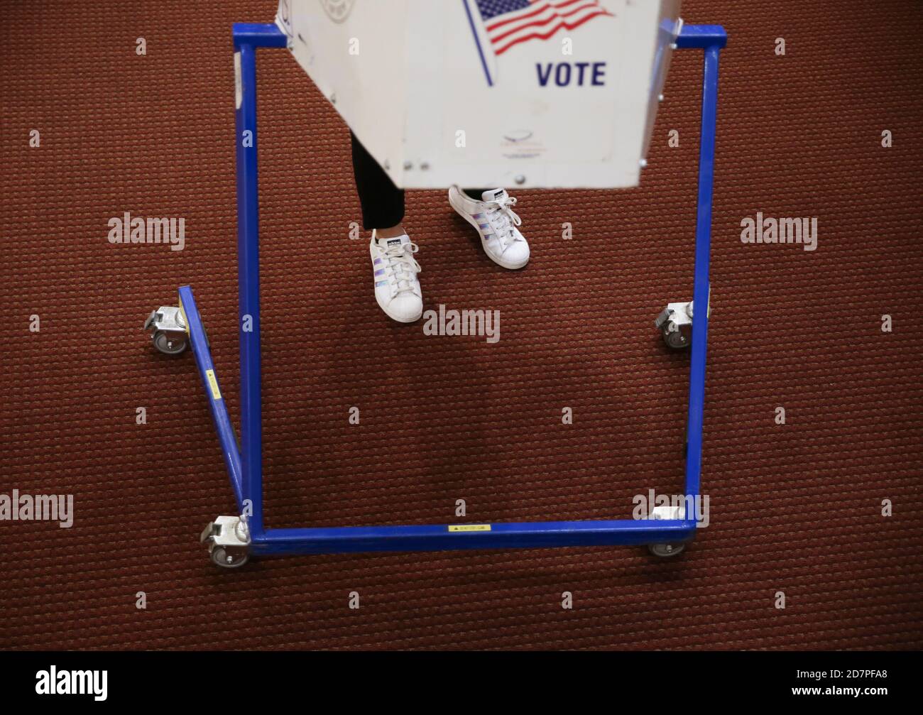 Voters cast their ballot at a polling site on the the first day of early voting for the 2020 election in New York City on Saturday, October 24, 2020. New York City voters for the first time have the option for early voting for the 2020 election and some waited online hours before their polling site opened at 10 a.m. Photo by John Angelillo/UPI Credit: UPI/Alamy Live News Stock Photo