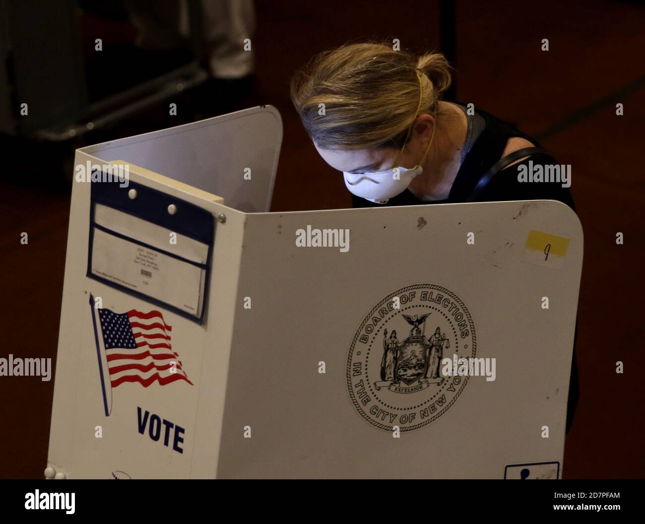 Voters cast their ballot at a polling site on the the first day of early voting for the 2020 election in New York City on Saturday, October 24, 2020. New York City voters for the first time have the option for early voting for the 2020 election and some waited online hours before their polling site opened at 10 a.m. Photo by John Angelillo/UPI Credit: UPI/Alamy Live News Stock Photo