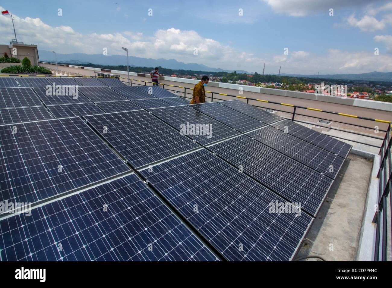 Solar panels or solar cell absorb sunlight at Bukittinggi City, West Sumatra Province, Indonesia to generate electricity Stock Photo