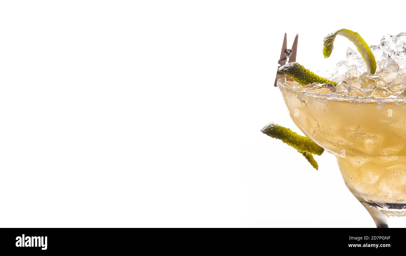 Alcoholic, non-alcoholic yellow cocktail with ice on white background Stock Photo