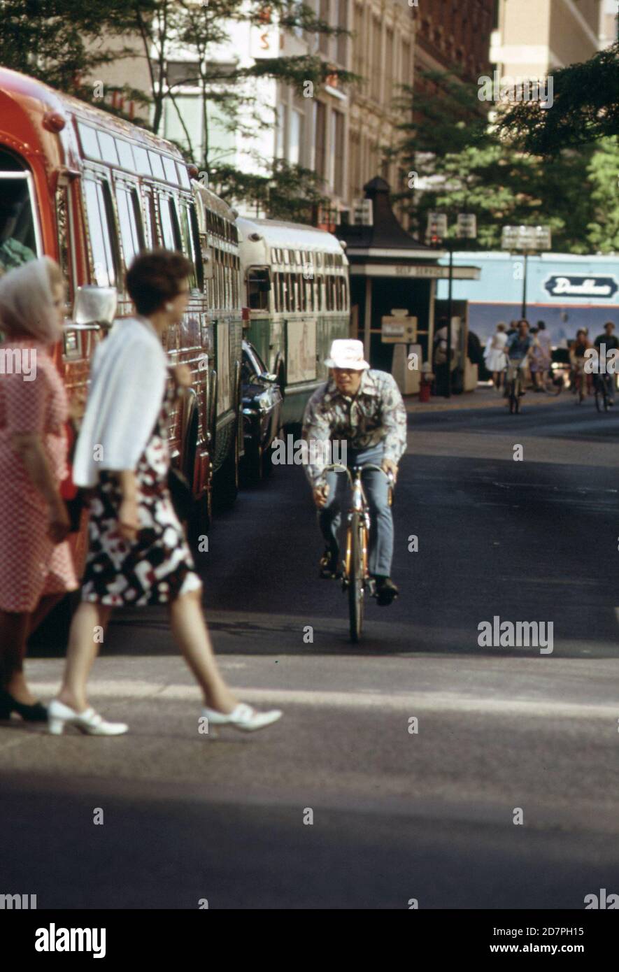 Transportation modes on Nicollet Mall--bus; bicycle; and foot (in or near Minneapolis) ca. 1973 Stock Photo