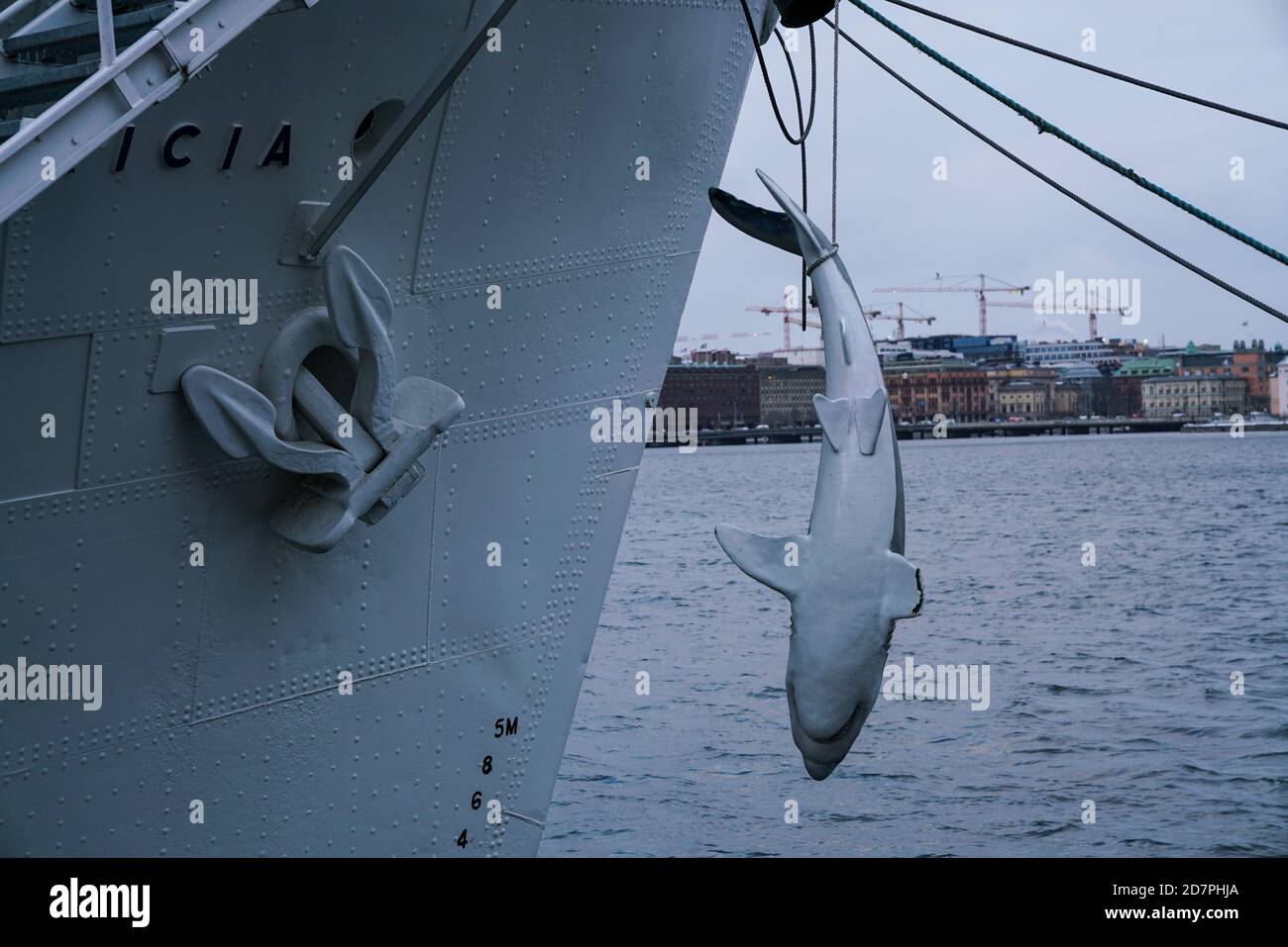 Stockholm - 02/06/2017: close up plastic fake shark hanging from a a boat on the bay in Södermälarstrand Stock Photo