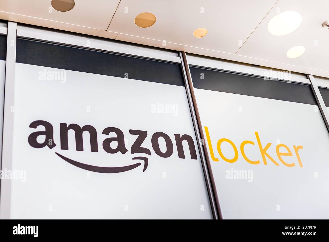 Amazon Locker in shopping mall, brand logo on pick up point for mail