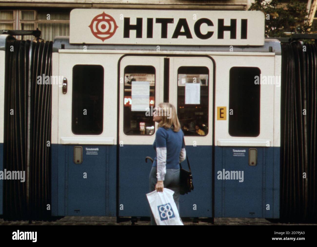 This small 8-seater trolley is used as a hinge so that two larger ones in front and back can get around a sharp turn (Munich)   ca. 1973 Stock Photo