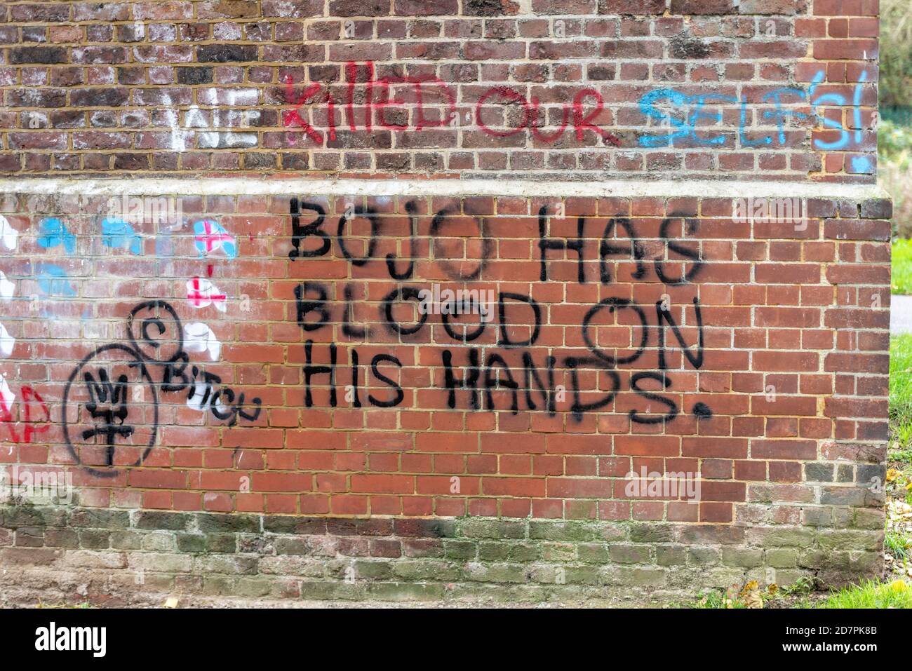 Boris Johnson has blood on his hands graffiti on brick viaduct in Central Park, Chelmsford, Essex, UK, during COVID 19 Coronavirus pandemic Stock Photo