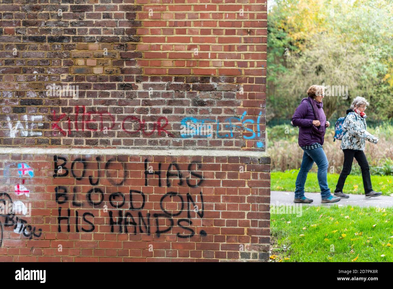 Boris Johnson has blood on his hands graffiti on brick viaduct in Central Park, Chelmsford, Essex, UK, during COVID 19 Coronavirus pandemic Stock Photo