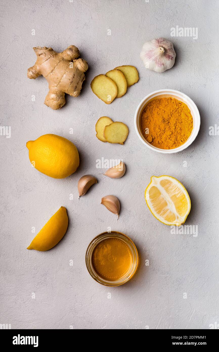 Turmeric, ginger, honey, garlic, lemon ingridients for making drinks