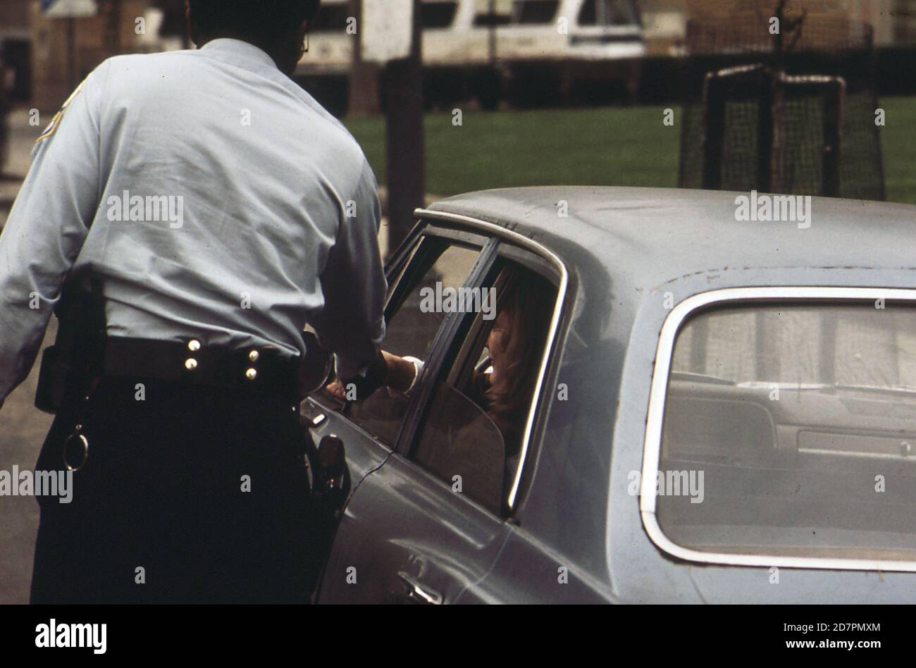 Officer catches traffic violator (Washington D.C.)   ca. 1973 Stock Photo
