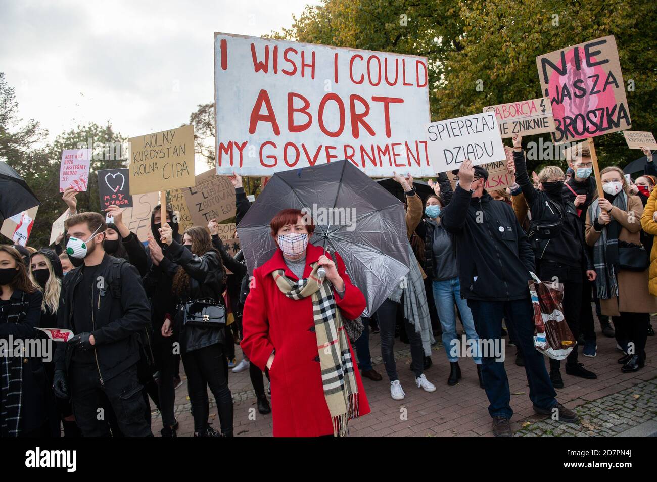 Protesters wearing face masks hold placards during the demonstration.The Constitutional Tribunal examined the motion of a group of deputies regarding the so-called eugenic abortion. In the opinion of the Tribunal, such an abortion, performed in the event of suspicion of severe fetal defects, is inconsistent with the Constitution. Women protest against the decision. Stock Photo