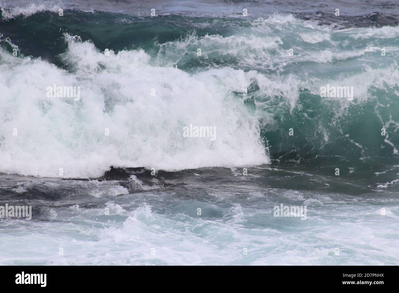Waves breaking on rocks Stock Photo - Alamy