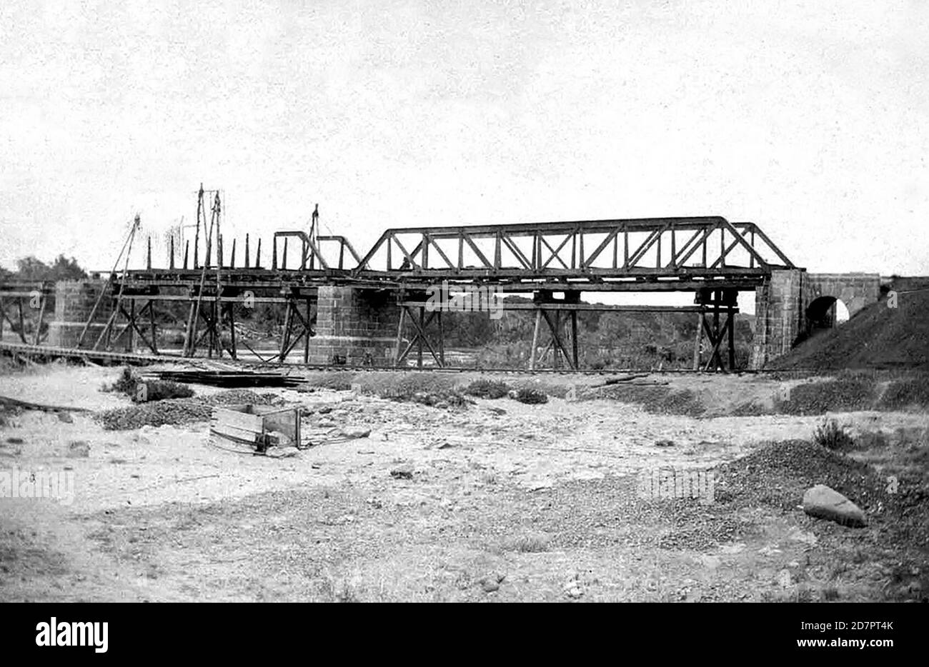 South Africa History:  Lowering of the first truss on the Komati River bridge during the building of the NZASM railway line ca.   January 1891 Stock Photo