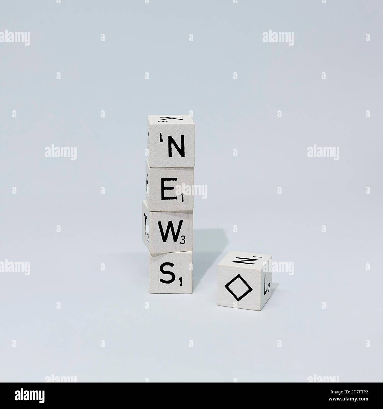 Cubes of letters stacked on top of each other form the word News, next to it a cube with a diamond as a joker, symbolic picture for news, news Stock Photo