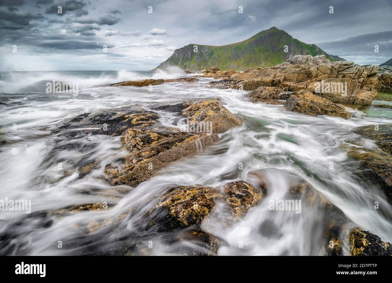 Rocks and wild sea surf, on the beach at Flakstad, Flakstadoy, Skagsanden, Flakstad, Lofoten, Nordland, Norway Stock Photo