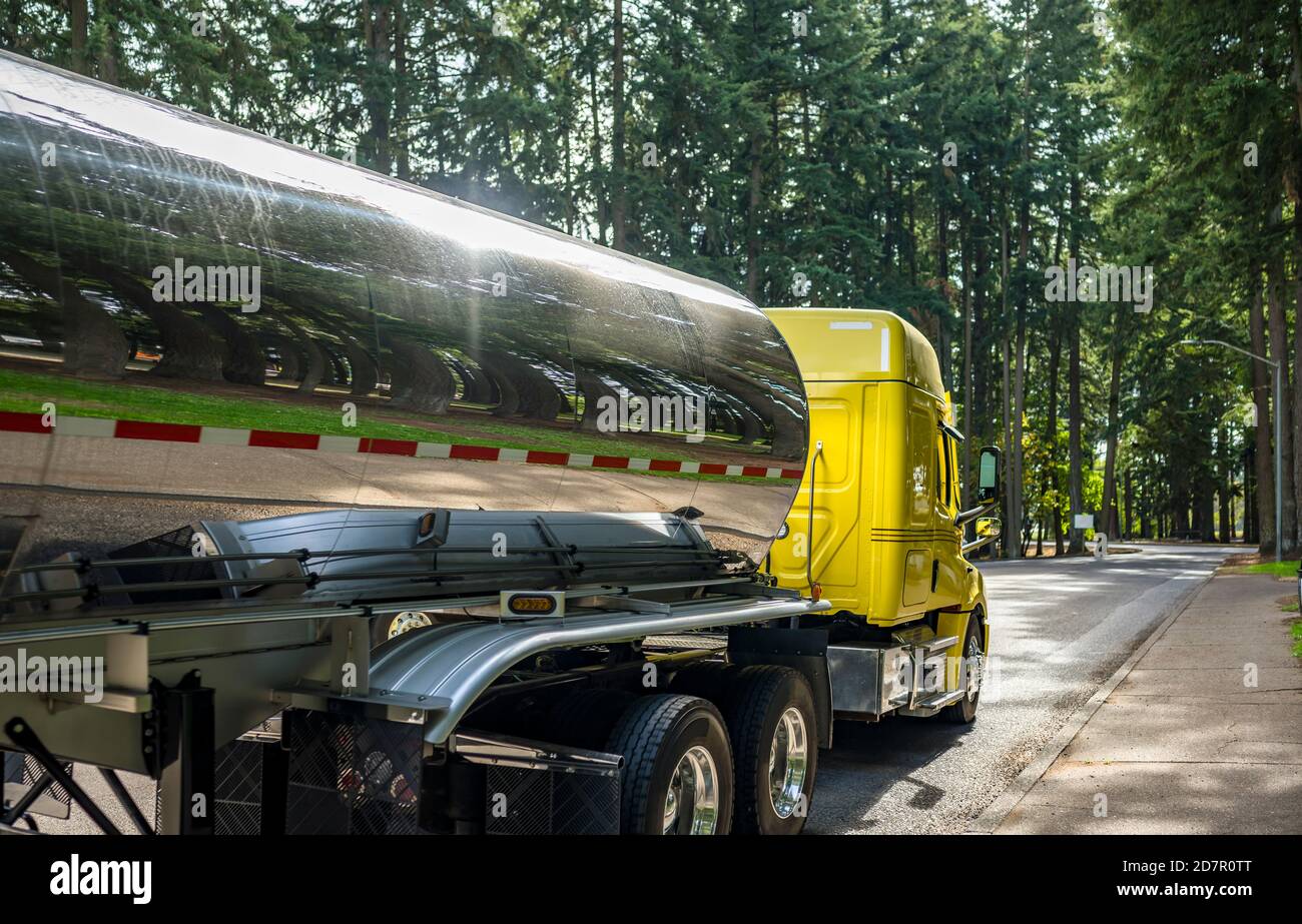 Shiny yellow industrial big rig diesel semi truck tractor with extended ...