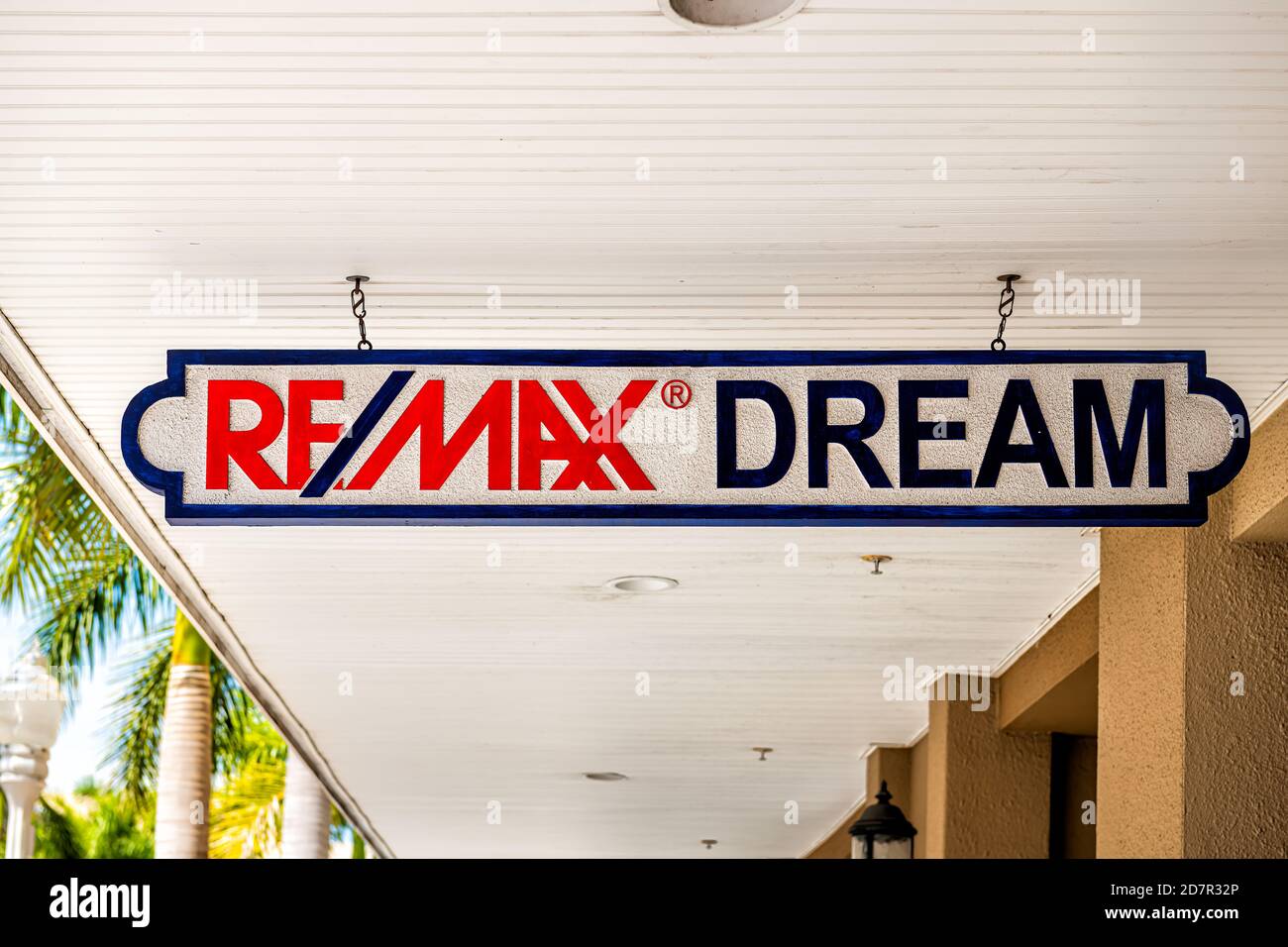 Fort Myers, USA - April 29, 2018: City town in Florida gulf of mexico coast with shopping street and closeup of sign for remax dream real estate offic Stock Photo