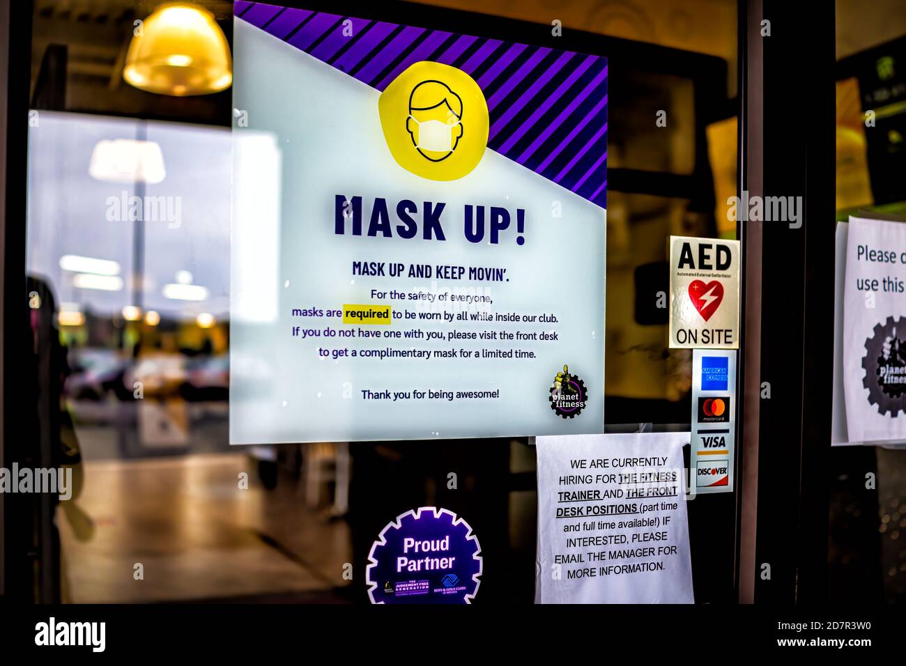 Sterling, USA - September 9, 2020: Planet fitness gym entrance sign for mask up requirement now open during coronavirus in Virginia with nobody Stock Photo