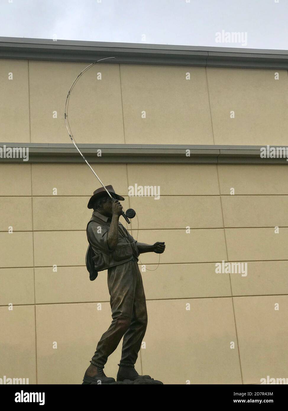 Fly fisherman statue in front of Scheels store in Frisco Texas Stock Photo