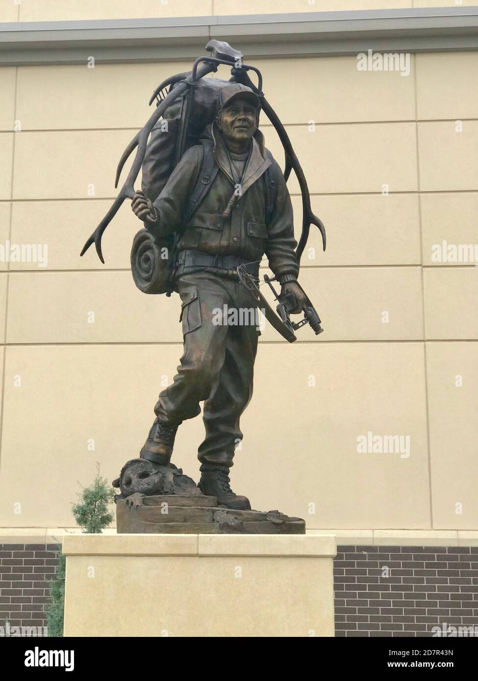 Hunter statue in front of Scheels store in Frisco Texas Stock Photo