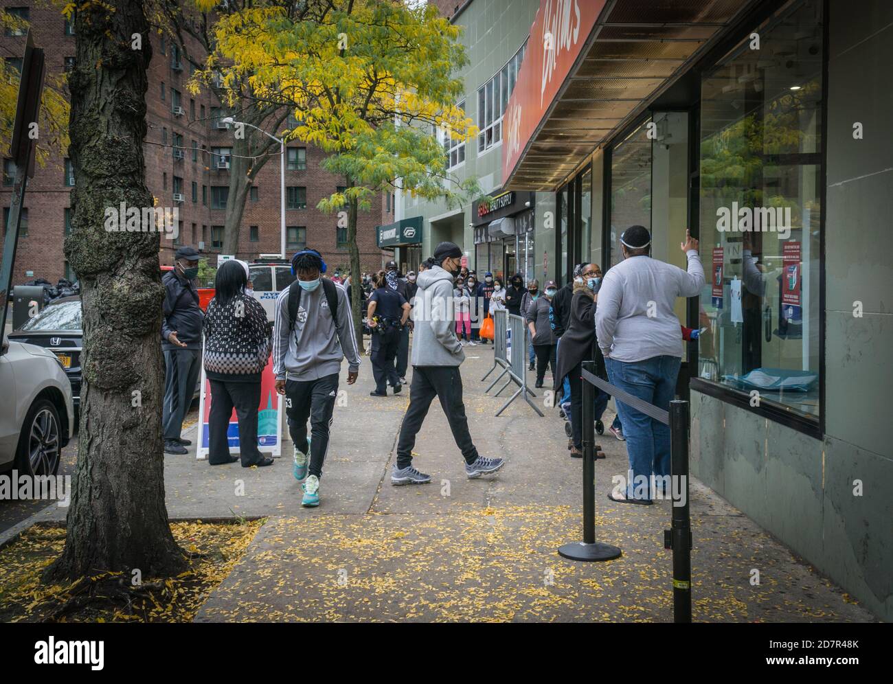 Bronx, United States. 24th Oct, 2020. Voters wait for hours on long
