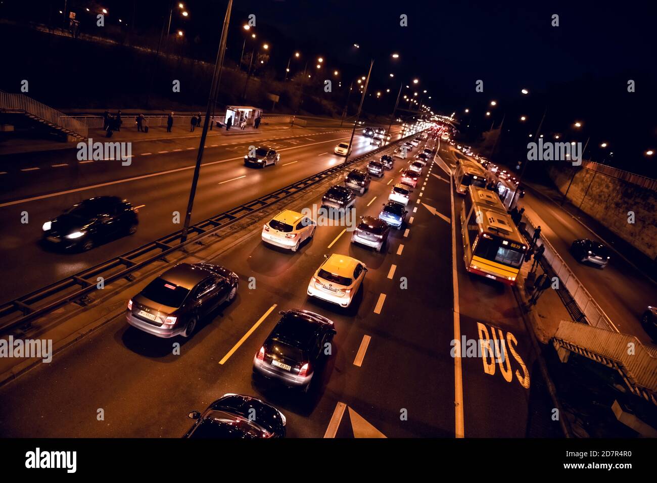 Warsaw, Poland - December 20, 2019: Above high angle aerial Dutch angle view of Aleja Armii Ludowej street avenue in Warszawa at night with traffic ca Stock Photo