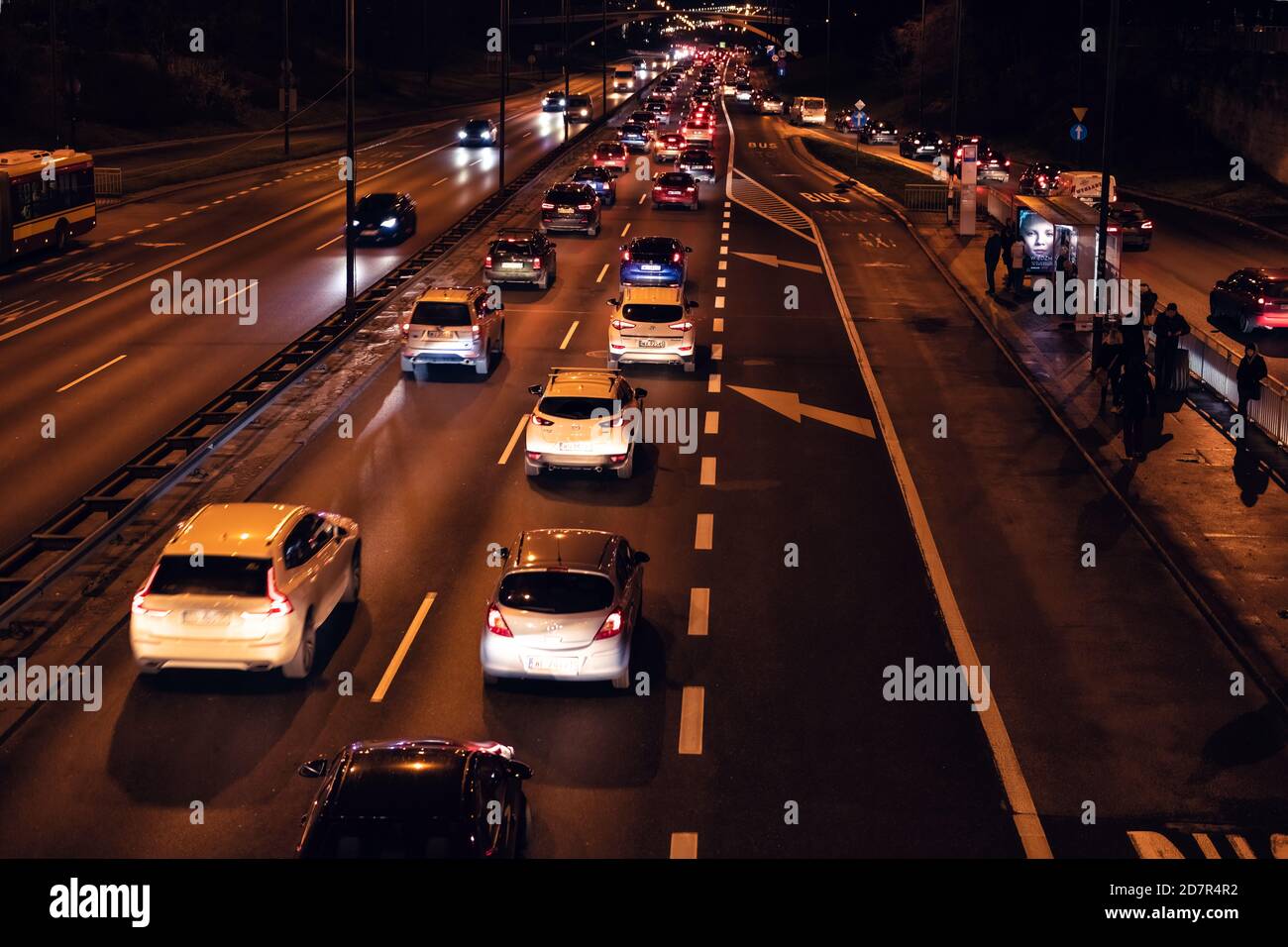 Warsaw, Poland - December 20, 2019: Above high angle aerial view of Aleja Armii Ludowej street avenue in Warszawa at night with traffic cars passing b Stock Photo