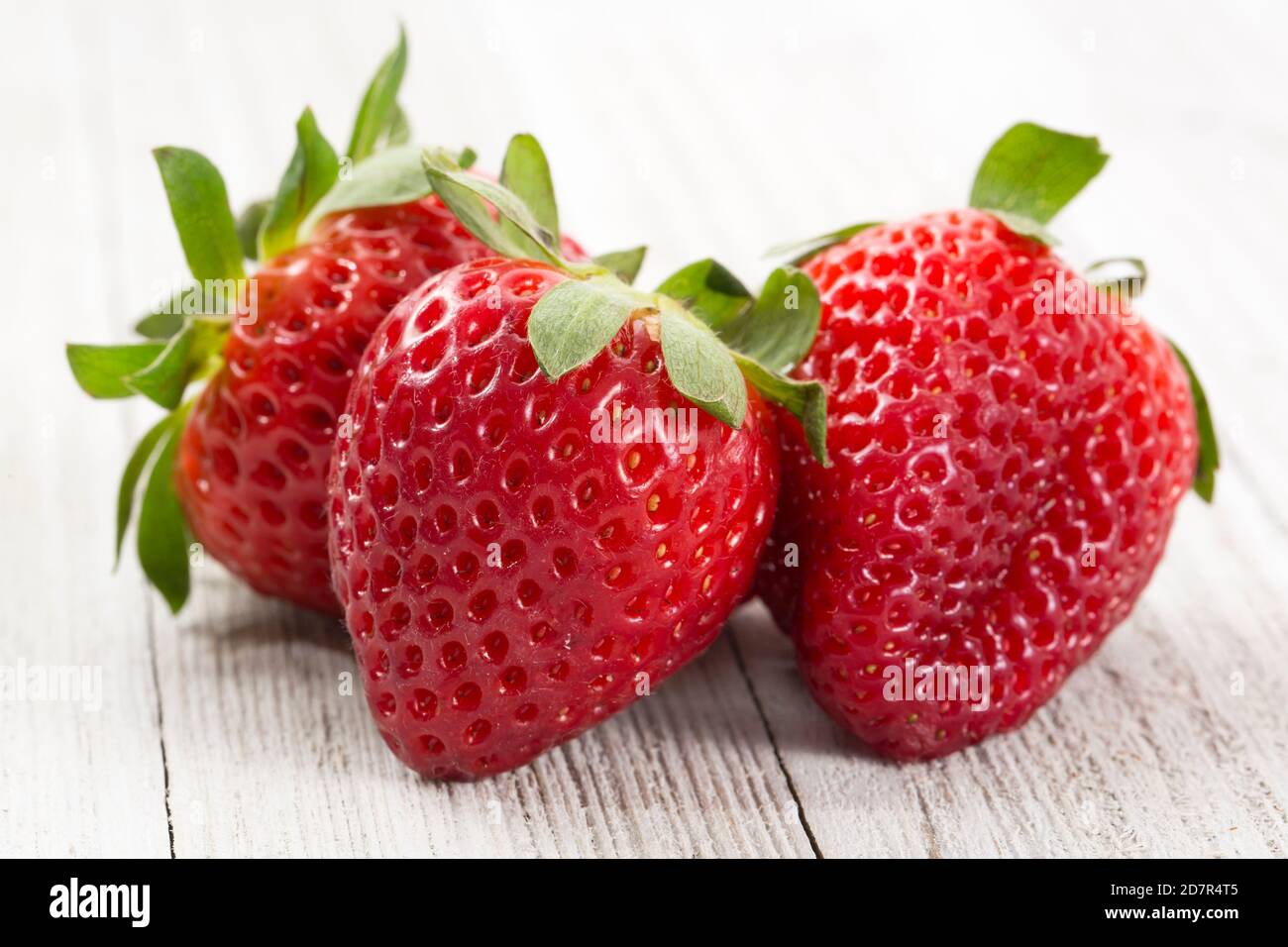 Fresh Strawberries on a White Wood Background Stock Photo - Alamy