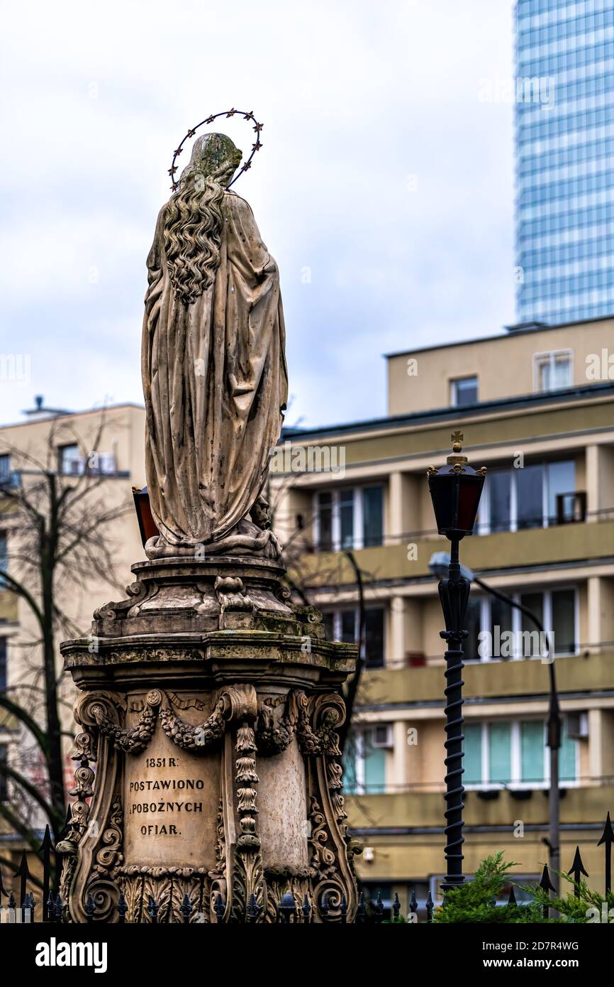 Warsaw, Poland - December 25, 2019: Immaculate conception Virgin Mary statue by Church of St. Anthony of Padua Roman catholic cathedral at Senatorska Stock Photo