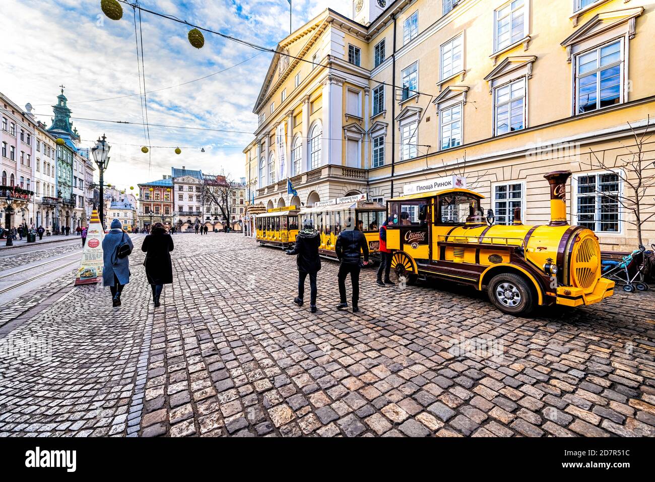 Lviv, Ukraine - January 21, 2020: Ukrainian Lvov city in old town with people on Svitoch sponsored guided tram tramway car tour at rynok market square Stock Photo