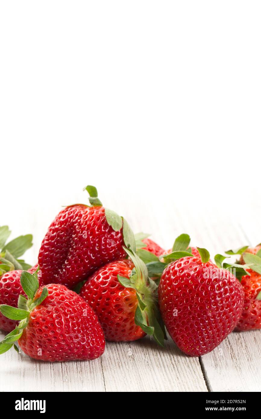 Fresh Strawberries on a White Wood Background Stock Photo - Alamy