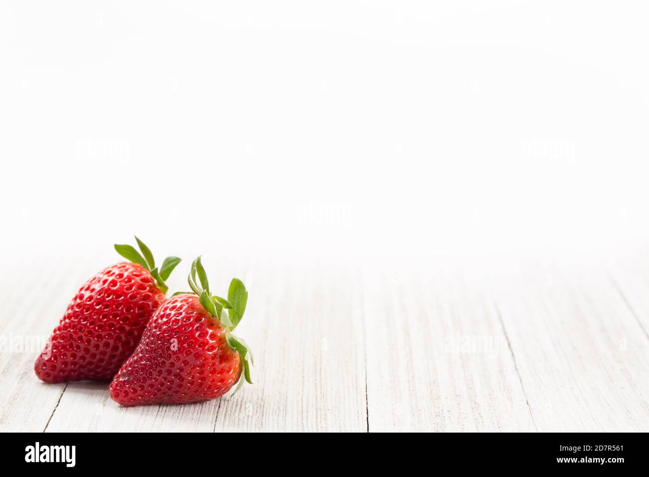 Fresh Strawberries on a White Wood Background Stock Photo - Alamy
