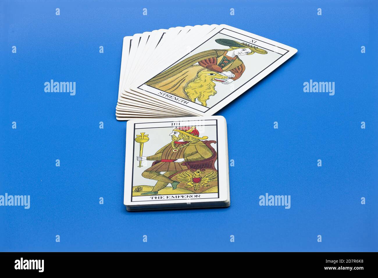 Stack of tarot cards on blue surface Stock Photo