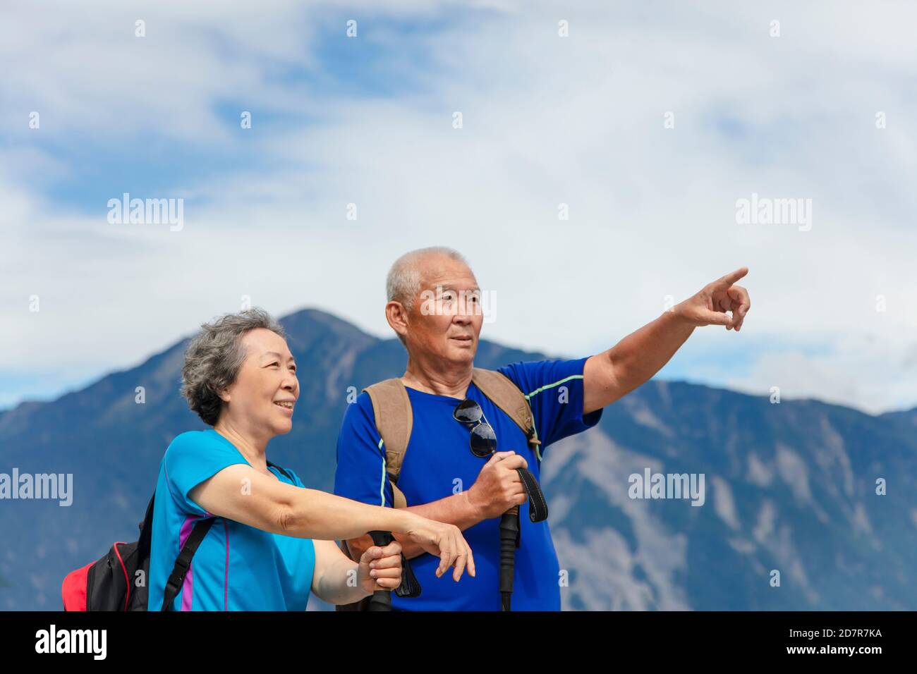 happy asian senior couple hiking in nature Stock Photo - Alamy