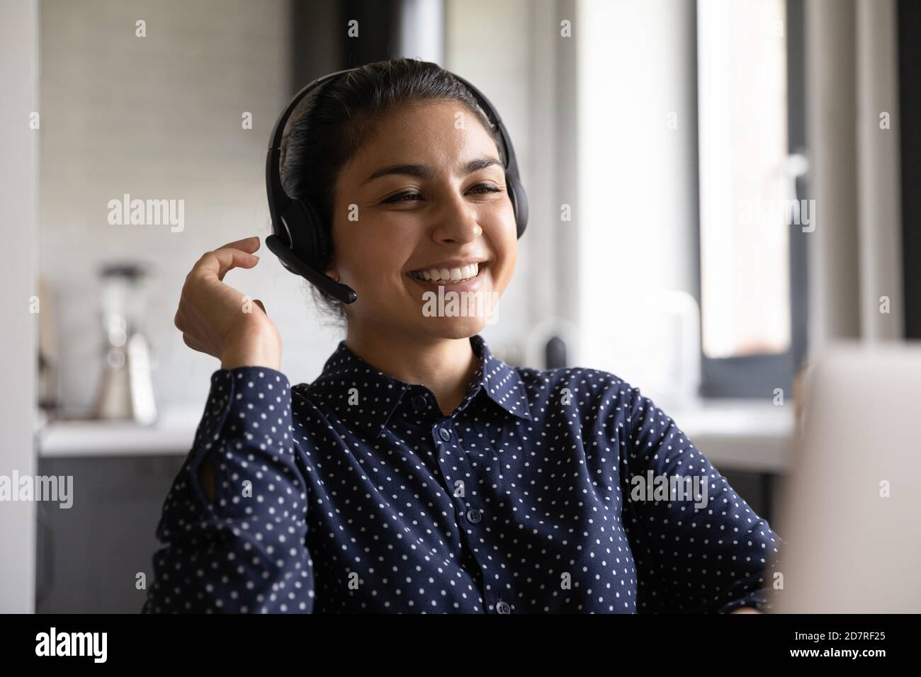 Happy Indian woman laugh talking on video call Stock Photo - Alamy