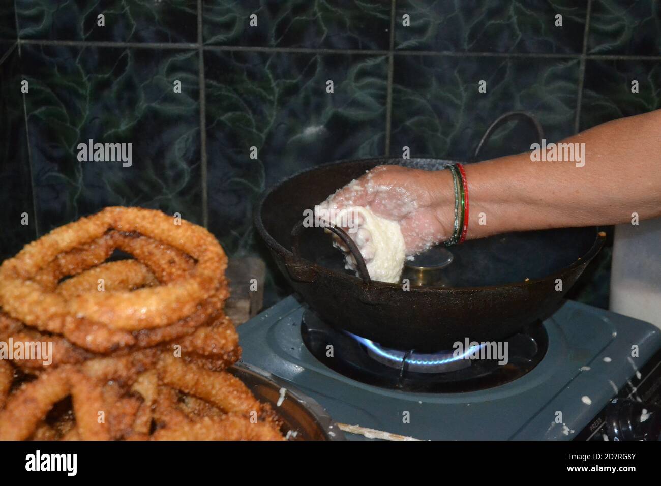 Making of rice breads called 'selroti' in Nepali language. Stock Photo