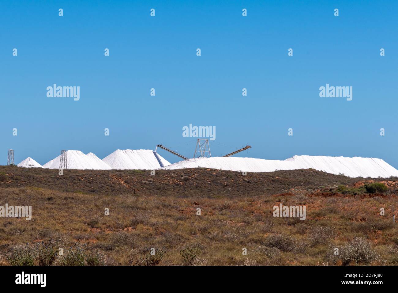 Salt harvested via evaporation is stacked near Onslow, ready for shipment. Stock Photo