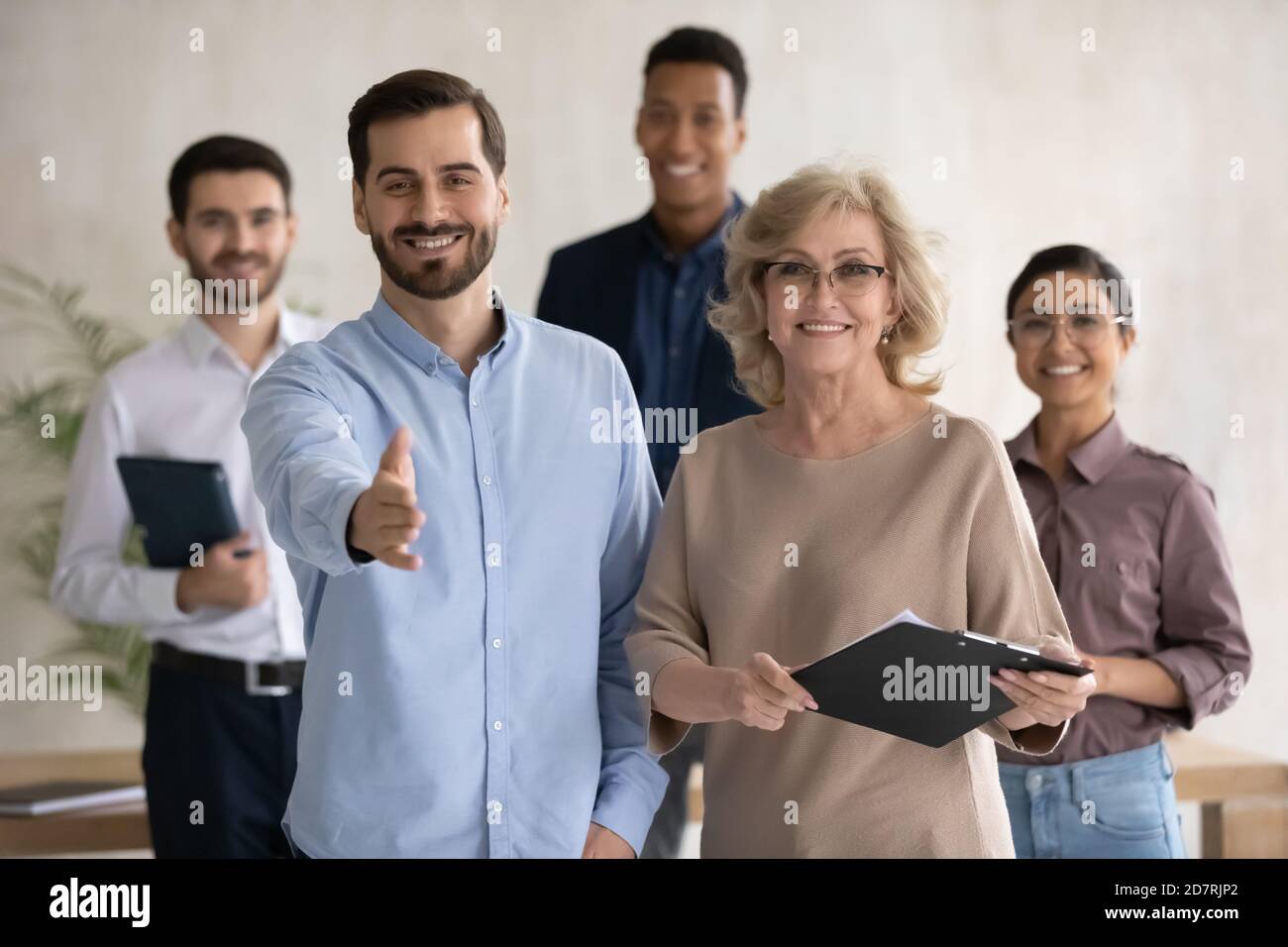 Portrait of smiling diverse businesspeople welcome stretch hand Stock ...