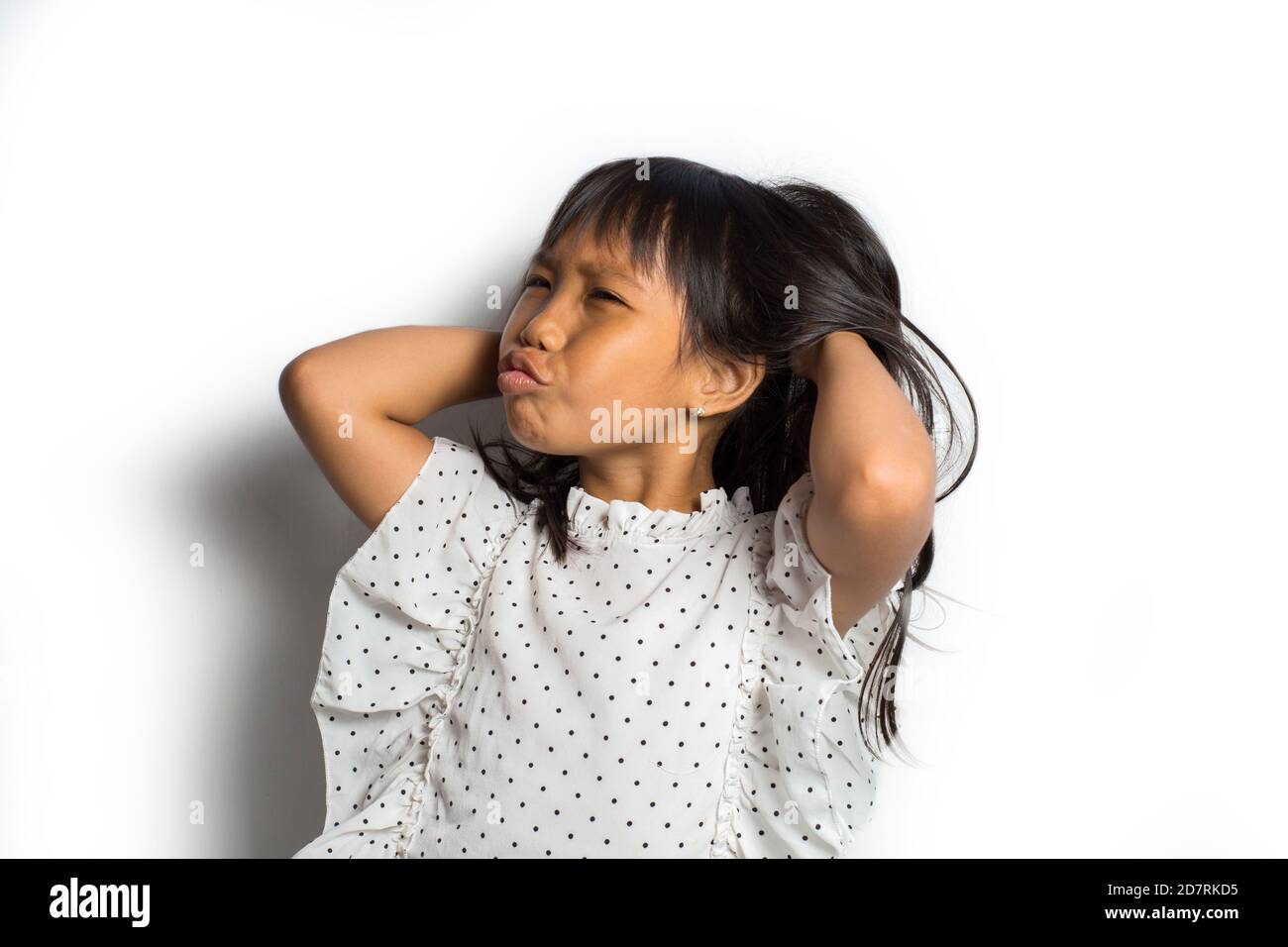Asian little girl itching scratching her head Stock Photo Alamy
