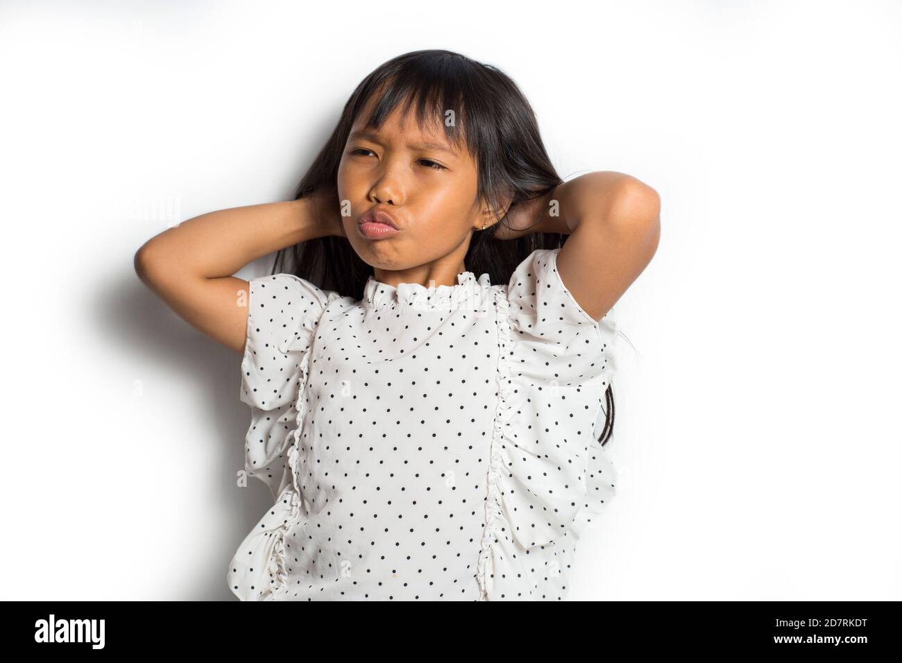 Asian little girl itching scratching her head Stock Photo Alamy