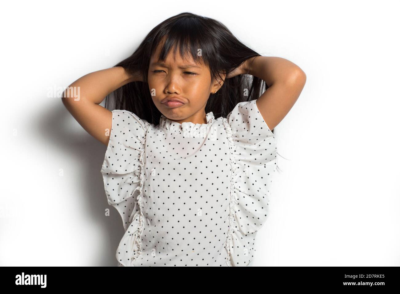 Asian little girl itching scratching her head Stock Photo Alamy
