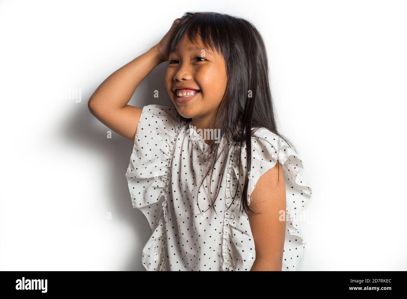 Asian little girl itching scratching her head Stock Photo Alamy