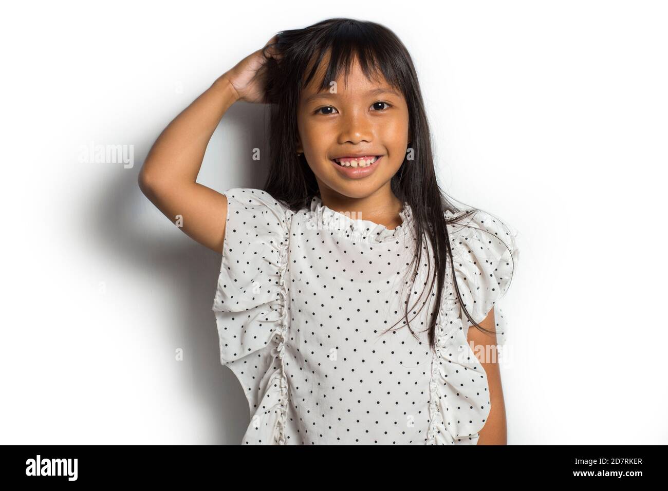 Asian little girl itching scratching her head Stock Photo Alamy