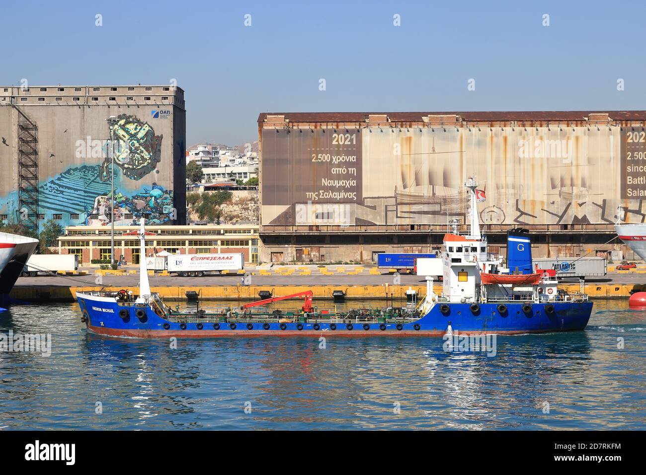 Archon Michail, an oil products tanker, departs the port of Piraeus, Greece.  The vessel was built in 1985 and sails under the Greek flag. Stock Photo