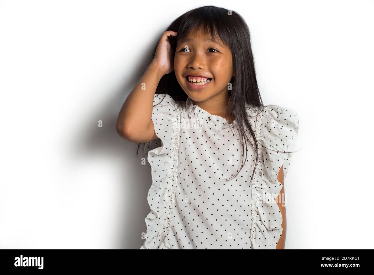 Asian little girl itching scratching her head Stock Photo Alamy