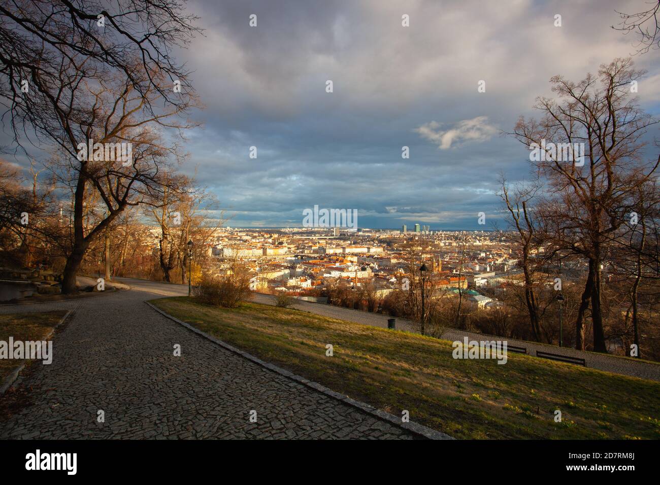 View from Petrin Park on Prague City at  sunset, Czech Republic. Aerial panoramic view of the histrical roofs. Prague, Czech Republic. Stock Photo
